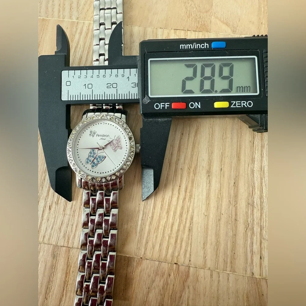 Armitron Now ladies butterfly silver tone watch NEW BATTERY